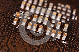 Close up ceramic capacitors on electronic circuit board
