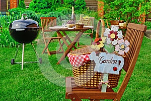 Close-up Of Chair With Hamper And Sign Garden, Party Scene