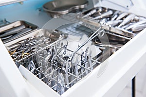 Close-up of chamber for sterile storage of medical and surgical tools in the dentist`s office. Surgery. Dentistry. Selective focus