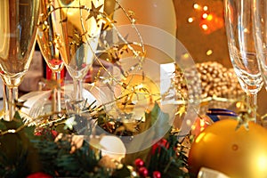 Close-up of champagne,baubles,candle lights.