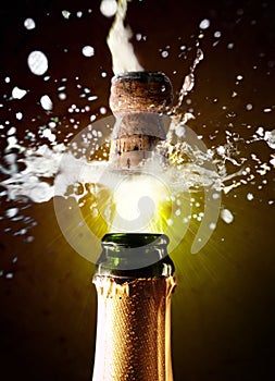 Close up of champagne cork pop photo
