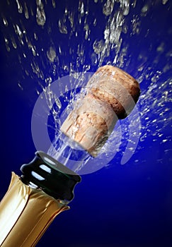 Close up of champagne cork popping