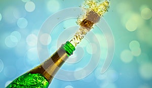 Close up of champagne cork popping on bokeh background