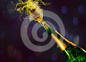 Close up of champagne cork popping on bokeh background