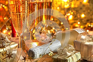 Close-up of champagne in glasses and gifts