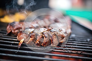 close-up of charred ribs on a hot grill