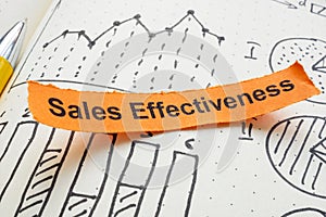 Close-up of charts and the phrase sales effectiveness. Evaluation and optimization of sales strategies. photo