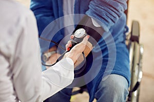 Close up checking the hypertension assessment of blood pressure photo