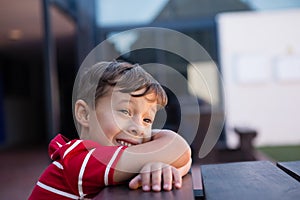 Close up of cheerful boy looking away