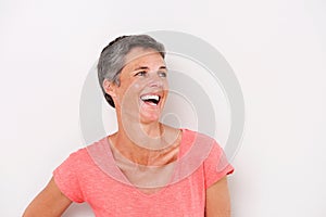 Close up cheerful middle age woman abasing white background