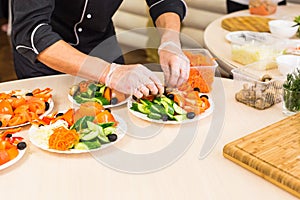 Close-up of chef cooking food kitchen restaurant cutting cook hands hotel man male knife preparation fresh preparing