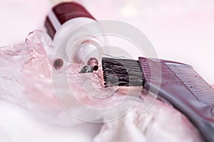 Close-up of chemical hair color dye set with comb brush