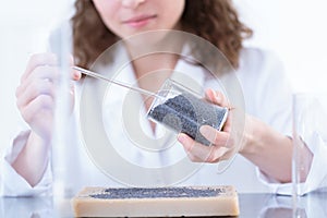 Chemist analyzing sample in laboratory