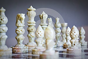 Close-up of chess pieces on chessboard