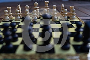 Close-up of chessboard with chess pieces photo