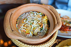 Close up Chicken Biryani is prepared in an earthen or clay pot called Haandi. Popular Indian non vegetarian food