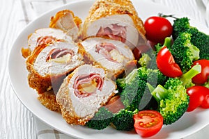 Chicken Cordon Bleu on a white plate photo