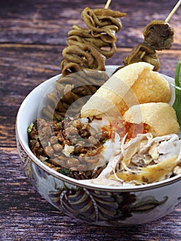 A close up of chicken porridge in a porridge bowl