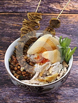 A close up of chicken porridge in a porridge bowl