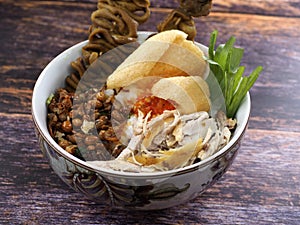 A close up of chicken porridge in a porridge bowl