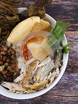 A close up of chicken porridge in a porridge bowl