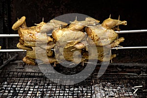 Close up chickens grilled in arow in street of Bangkok