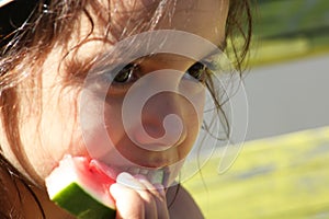 Close-up of a child eating watermelon