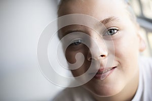 Close-up of child girl smiling face looking at camera