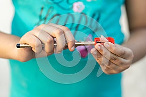 Close up of child sharpening pencil