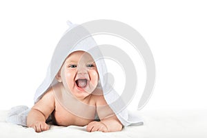 Close-up child in white towel isolated on white background. Bathing babies and restful sleep. funny toddler