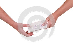 Close-up of children passing a note