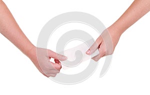 Close-up of children passing a note