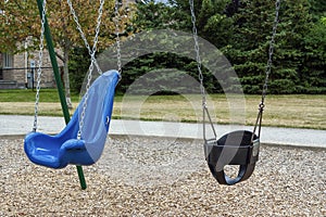 Close-up of a children`s swing in the park