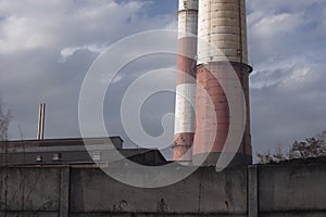 Close-up of chimneys and buildings by coal mine in Katowice. Industrial landscape. Global warming, CO2 emission, coal energy issue