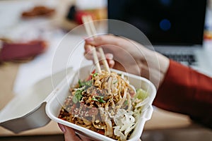 Close up of chinese food, lunch time in an office.