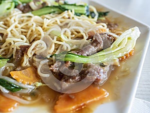 Close-up of Chinese stir-fry beef in a soy sauce based smooth gravy