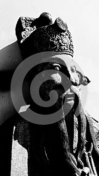 Close up Chinese stone sculptures or sculptures with shade of sunlight and shadow in black and white tone located in Thai temple