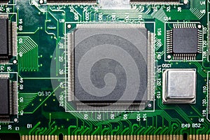 Close-up of a chip on a computer board and a small smart device processing the phone. Select the focus and background of the copy