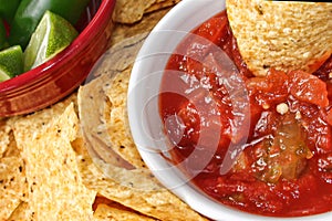 Close-up of Chips and Salsa and chile peppers