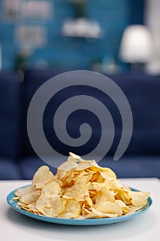 Close up of chips snack on table in empty living room