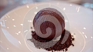 Close-up of a chocolate ball desert on t