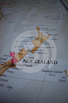Close up of Christchurch pin pointed on the world map with a pink pushpin
