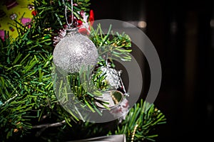Close up of Christmas decorations, gifts on Christmas tree, gifts, for new year background. vintage tone with copy space