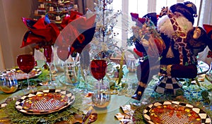 Close up of Christmas table setting with Santa Claus figurine