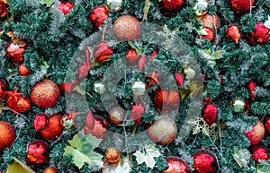 Close up Christmas tree decoration with red ball, gold ball, golden snowflake, red star. Xmas background. Christmas and New Years