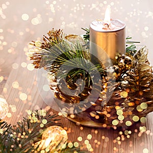 Close up of christmas tree with lights, candle and decorations. Copy space