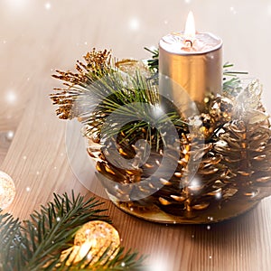 Close up of christmas tree with lights, candle and decorations. Copy space