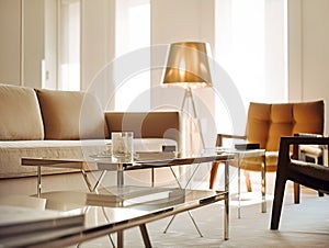 Close up of chrome coffee table near beige sofa and orange chair against window. Mid-century home interior design of modern living