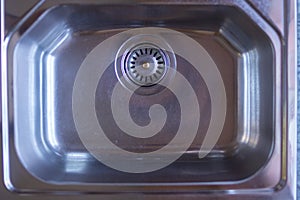 Top view Close up Chrome kitchen sink background with copy space.