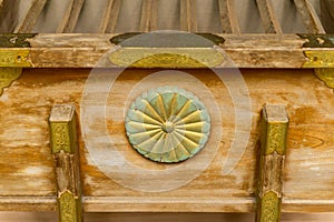 Close-up of chrysantehmum seal on donation box